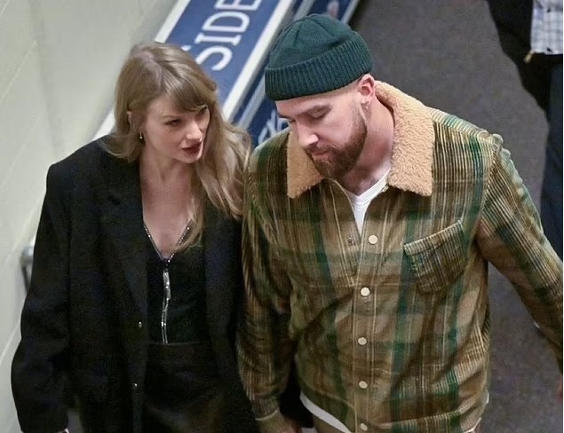 Taylor Swift gazes lovingly at her boyfriend Travis Kelce as they leave Arrowhead together pics
