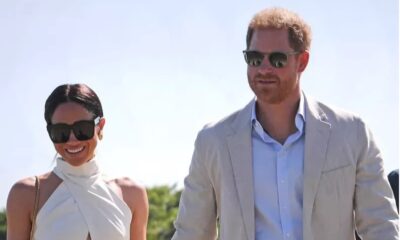 Meghan Markle and Prince Harry walk at the Royal Salute